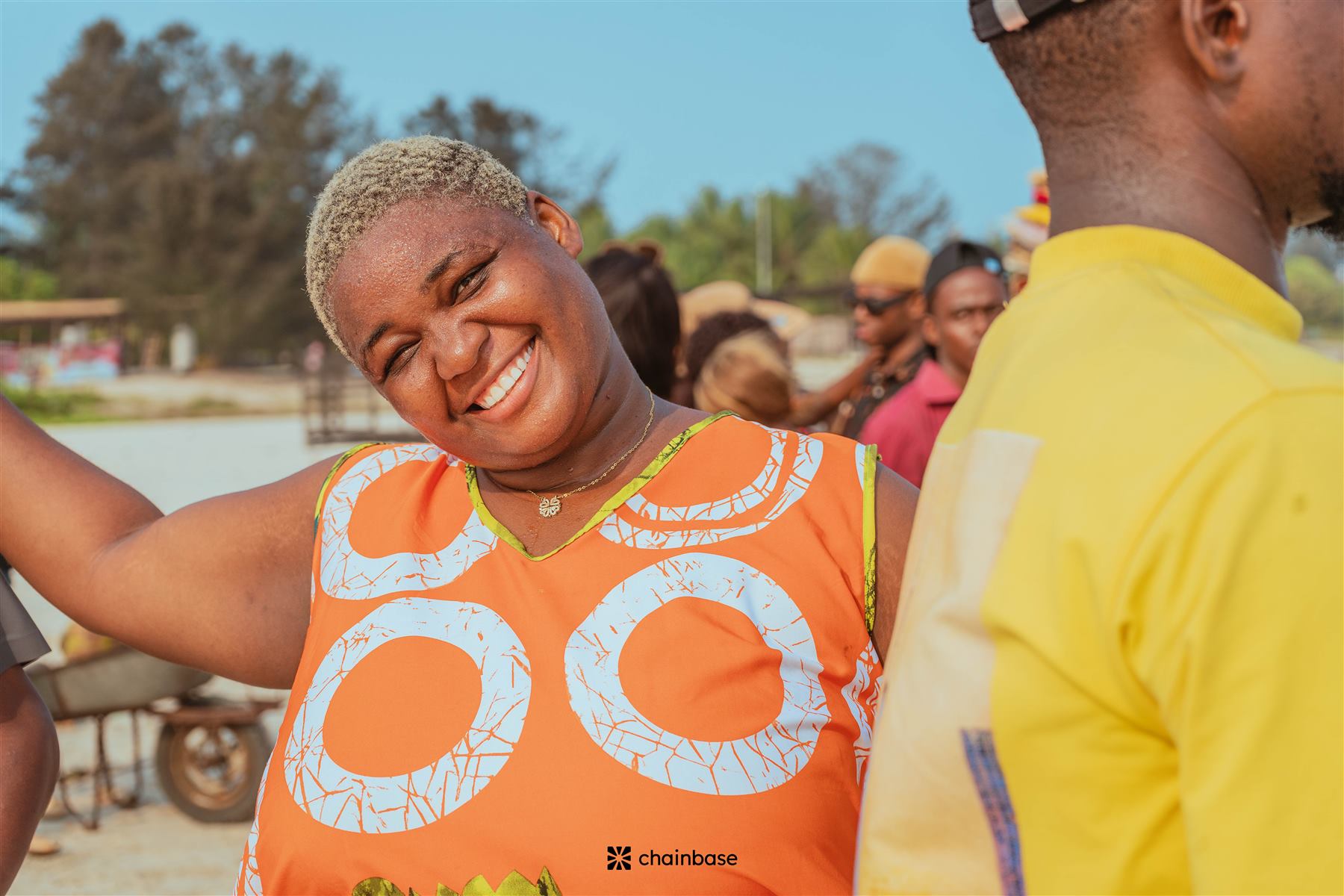 A smiling attendee at Chainbase Beachfest