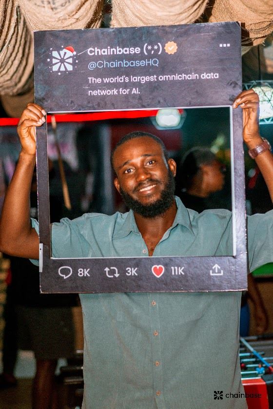 Asian Dickson at the Chainbase Mixer Party, posing with the Chainbase social media frame