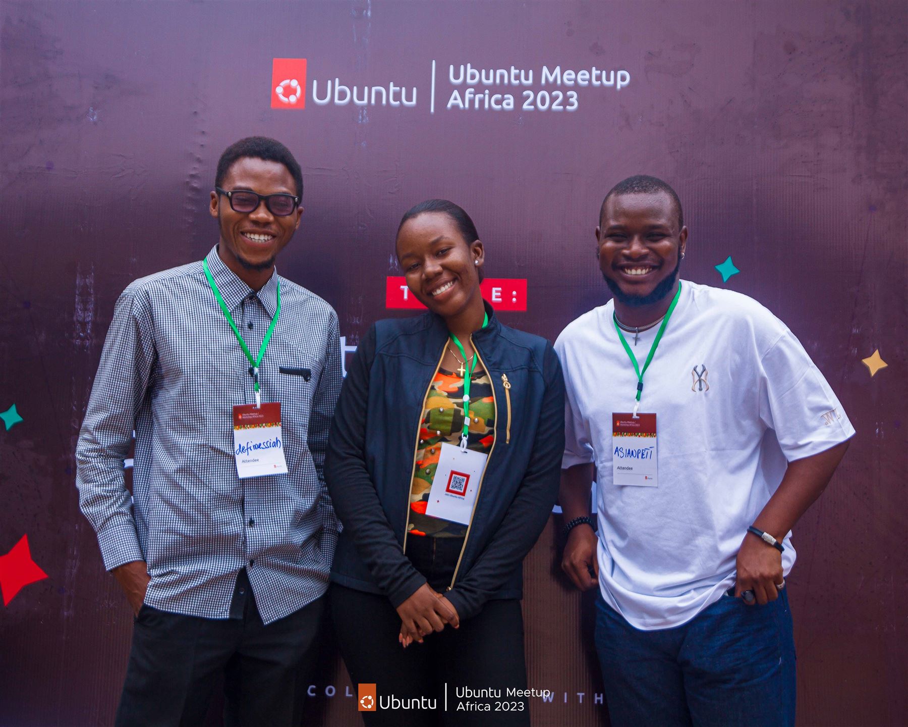 Asian Dickson, badge reading Asianpett, with fellow attendees at Ubuntu Meetup Africa 2023