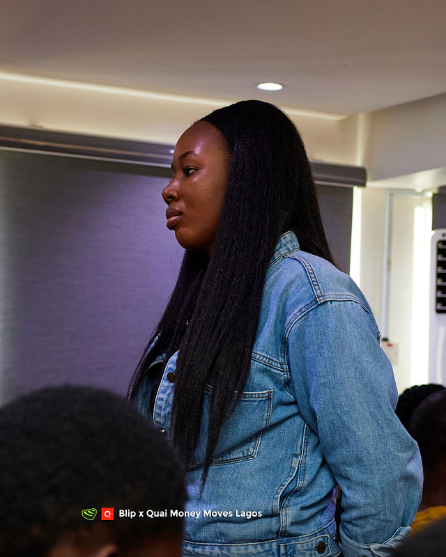 An attendee in profile at Money Moves Lagos