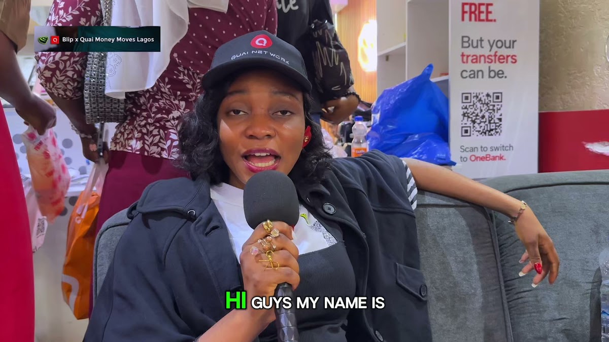 An attendee giving a testimonial on camera at Money Moves Lagos