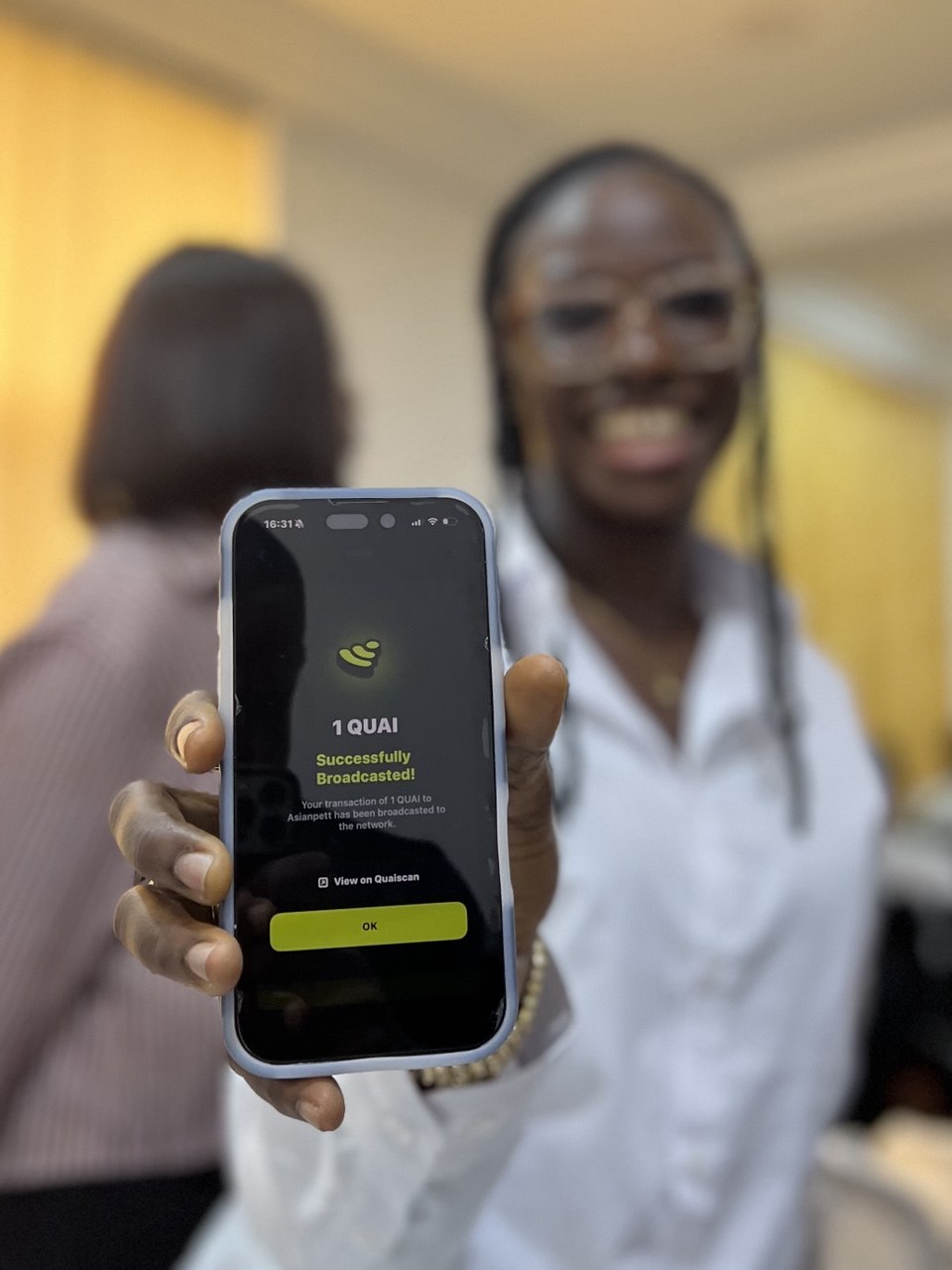 A phone showing a successfully broadcast QUAI transaction sent to Asianpett